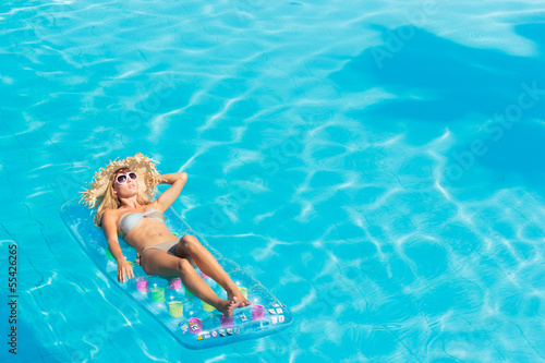 woman relaxing at the swimming pool