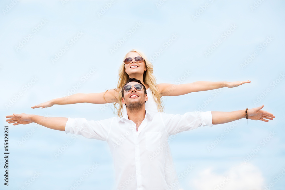 couple holding hands up at sea side couple holding hands up at sea side