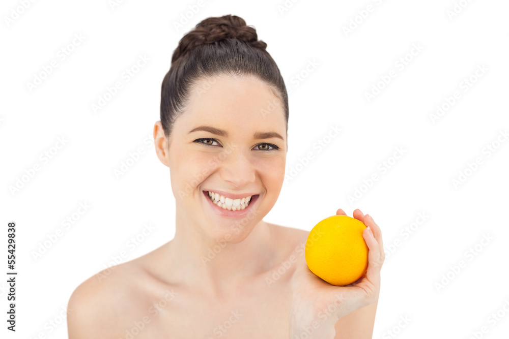 Cheerful pretty model holding orange Cheerful pretty model holding orange
