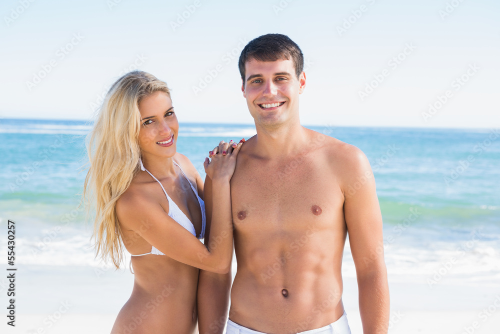 Attractive young couple smiling at camera Attractive young couple smiling at camera