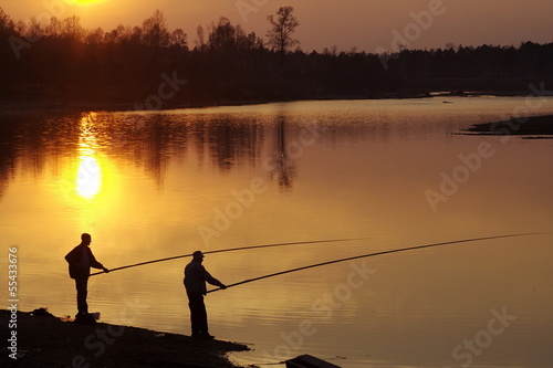 Two fishers on river
