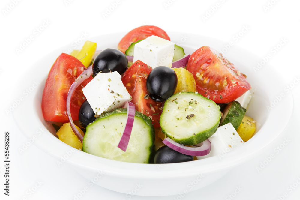 fresh greek salad in white bowl fresh greek salad in white bowl