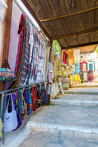 Traditional textiles on a market stall  in Greece