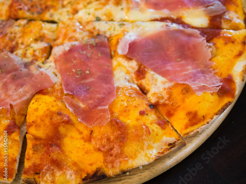 A pizza with ham photo