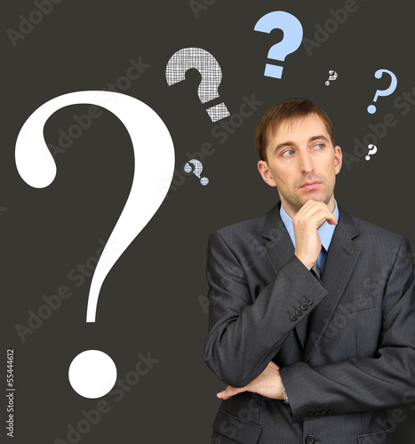 Man thinking surrounded by ...