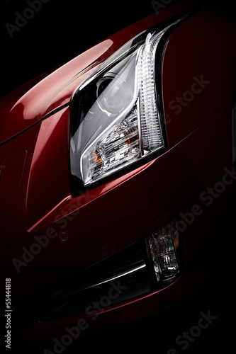 Headlight of the one nice red car
