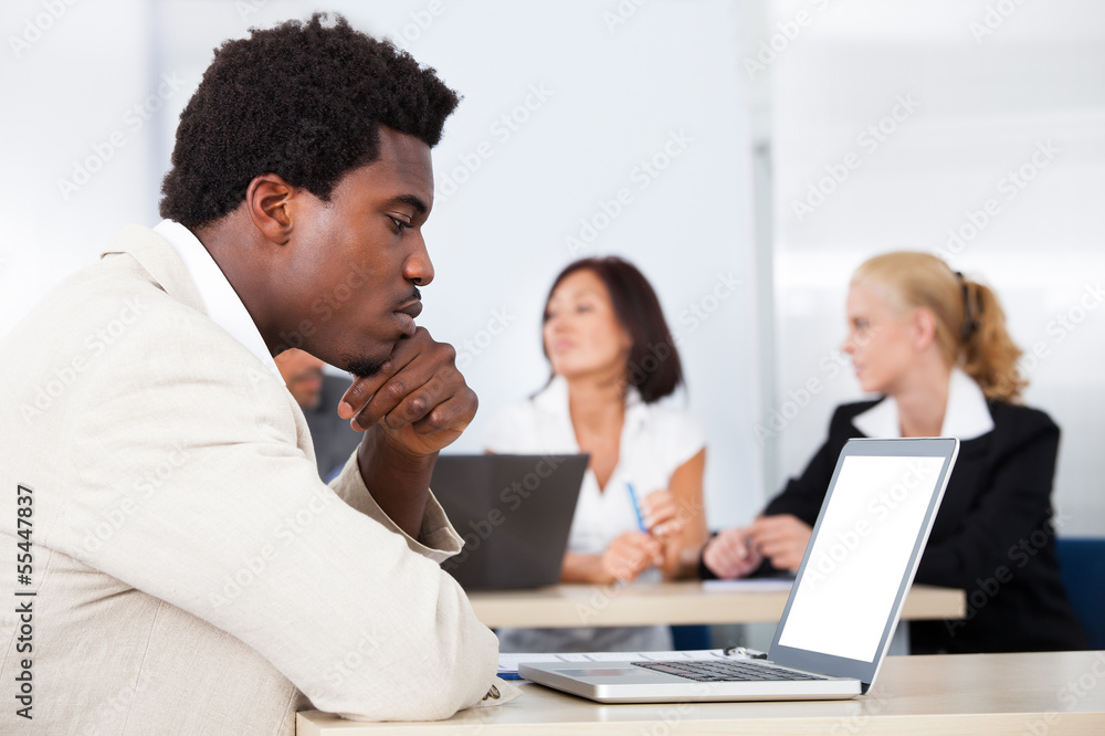 Fototapeta premium African Businessman Looking At Laptop