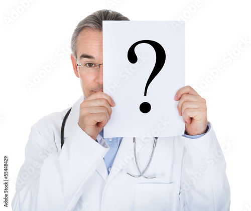 Portrait of doctor holding paper with question mark