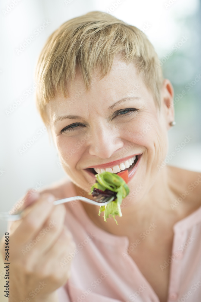 Closeup Of Happy Woman Eating Vegetable Salad Closeup Of Happy Woman Eating Vegetable Salad