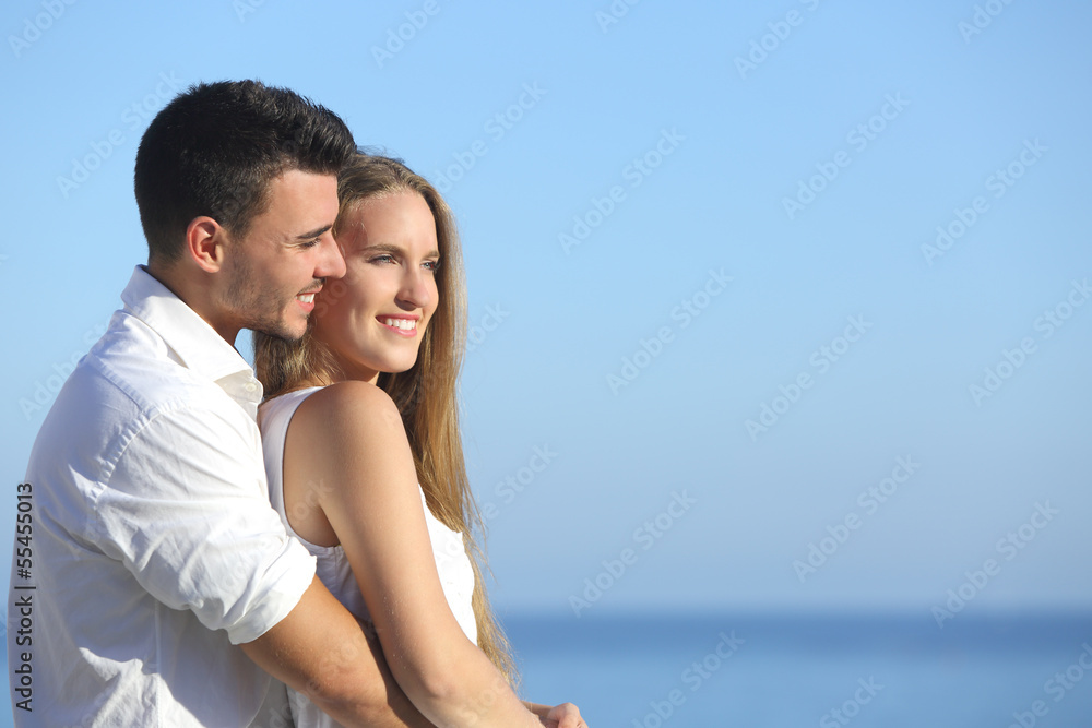 Attractive couple flirting and cuddling looking ahead Attractive couple flirting and cuddling looking ahead