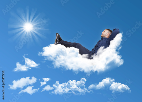 businessman relaxing on a cloud