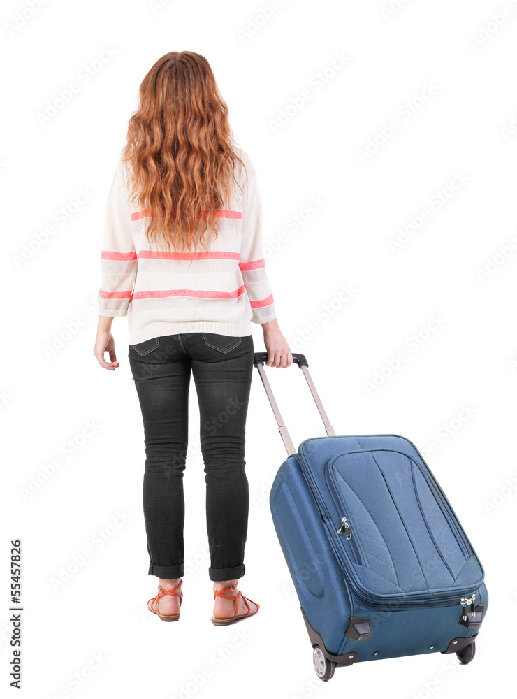 back view of walking woman with suitcase. back view of walking woman with suitcase.