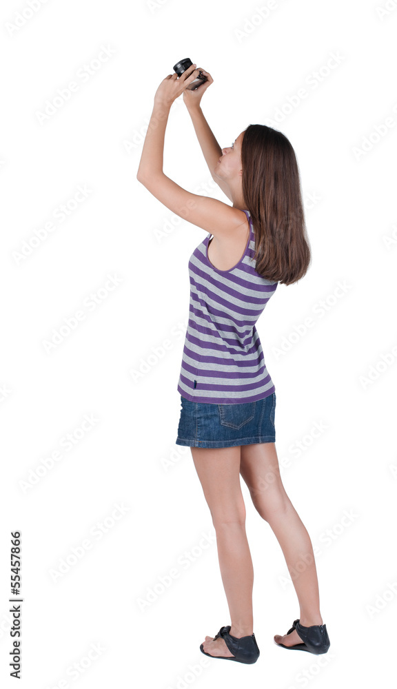 Back view of woman photographing. Back view of woman photographing.