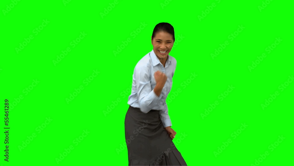 Cheerful businesswoman gesturing on green screen Cheerful businesswoman gesturing on green screen