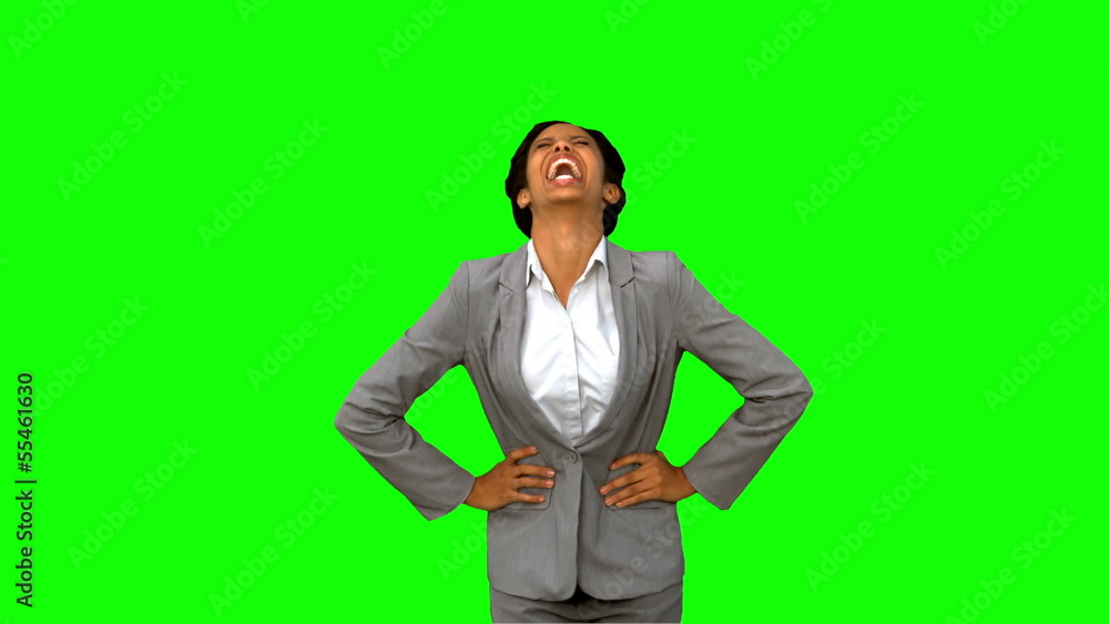Attractive businesswoman laughing on green screen Attractive businesswoman laughing on green screen