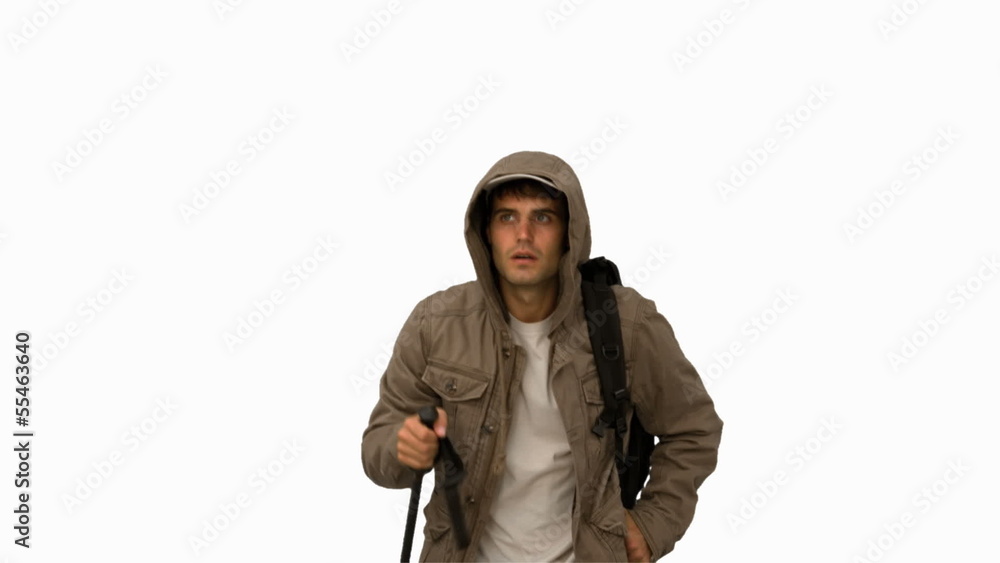Man with a coat trekking on white screen Man with a coat trekking on white screen
