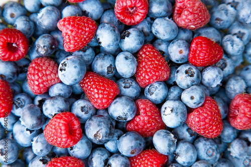 Blueberry with raspberry macro photo