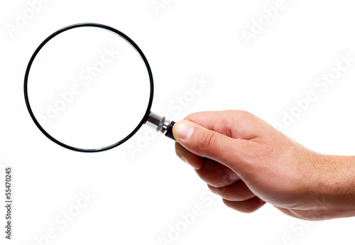 Hand with magnifying glass loupe.