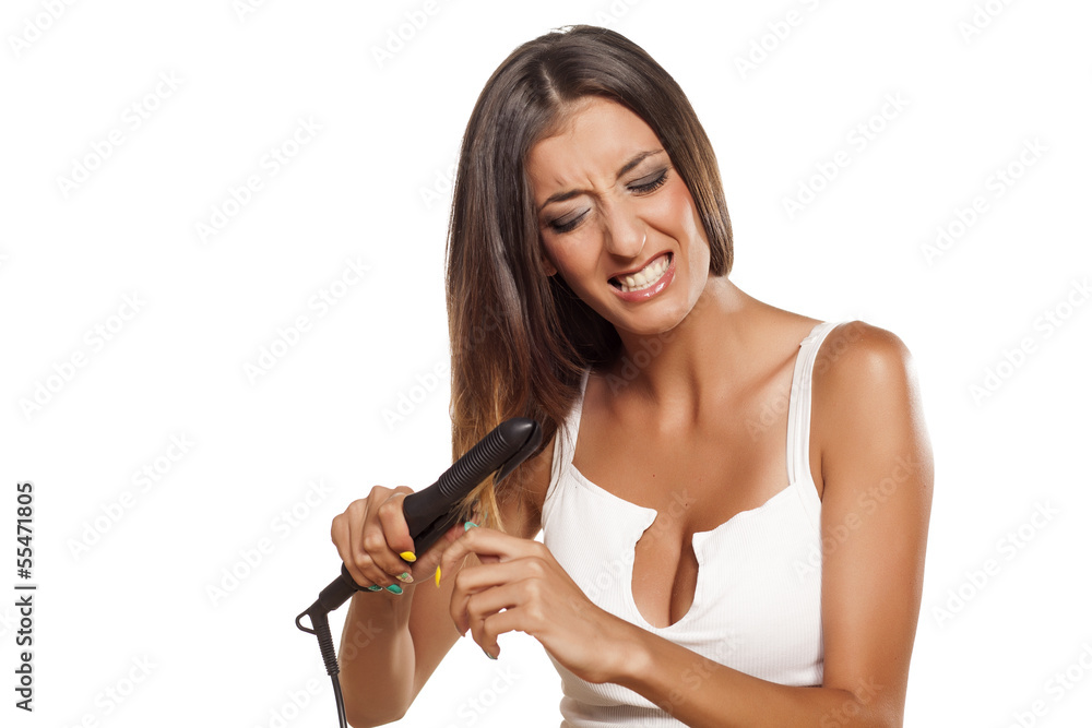 nervous girl straightens her hair nervous girl straightens her hair