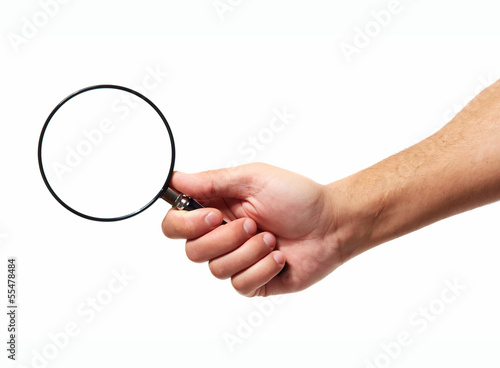 Hand with magnifying glass loupe.