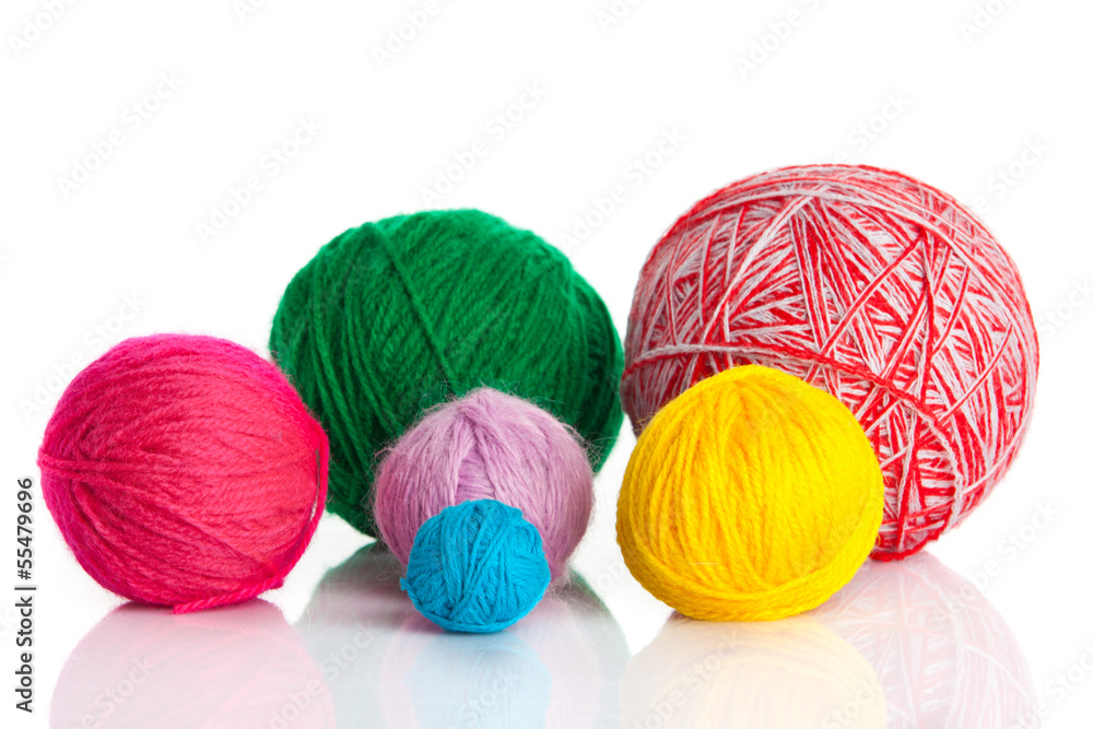 colorful different thread balls. wool knitting on white backgr colorful different thread balls. wool knitting on white backgr