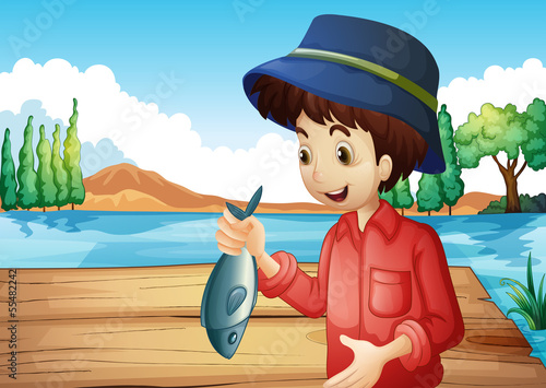 A fisherman holding a fish