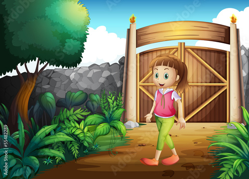 A young girl at the gated yard