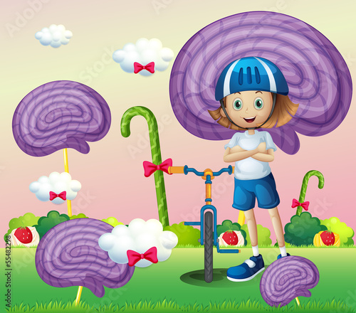 A young female biker surrounded with giant spiral lollipops