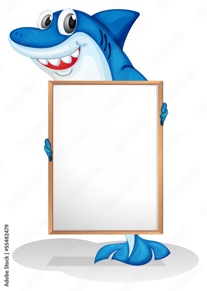 Fototapeta premium A smiling shark holding an empty whiteboard