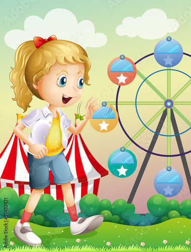 A girl walking across the carnival