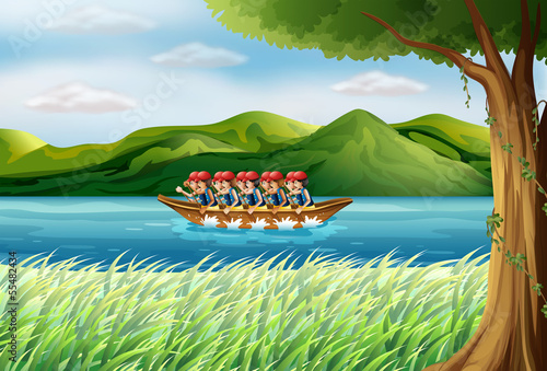 A group of boys riding on a boat