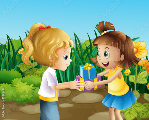 Two friends exchanging gifts outdoor