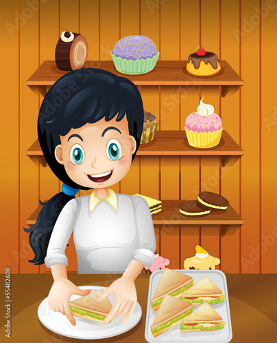 A happy mother preparing sandwiches