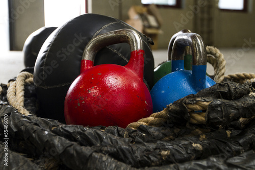 Kettle bells, rope and a medicine ball used for crossfit