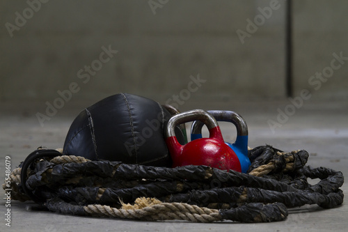 Kettle bells, rope and a medicine ball used for crossfit