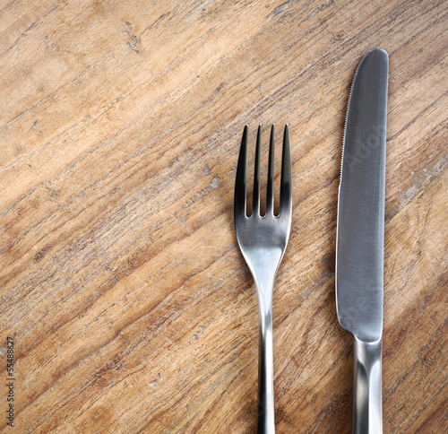 Table background with fork and knife