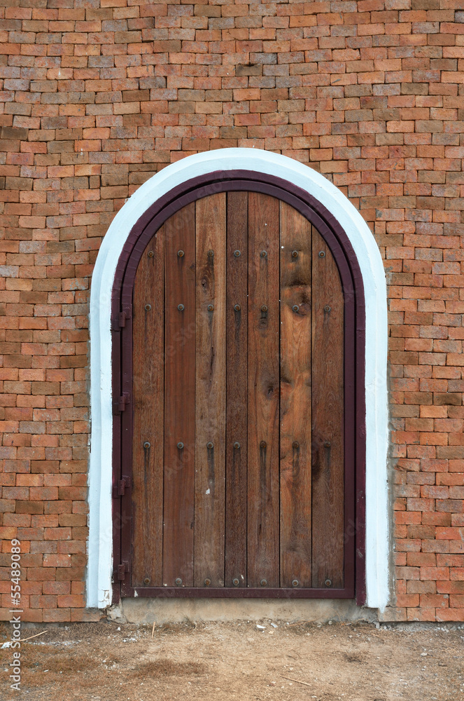 arch wooden door with brick building arch wooden door with brick building