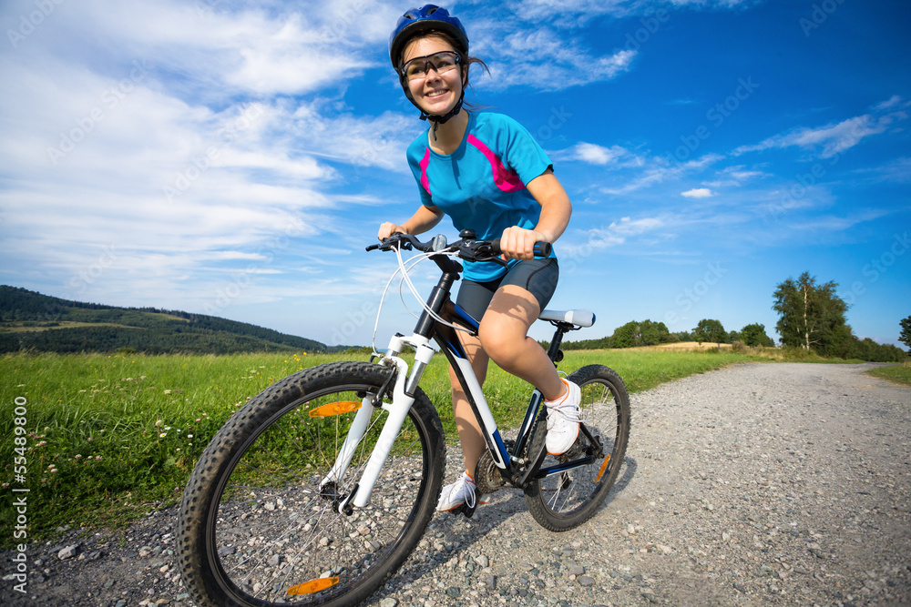 Fototapeta premium Healthy lifestyle - teenage girl biking