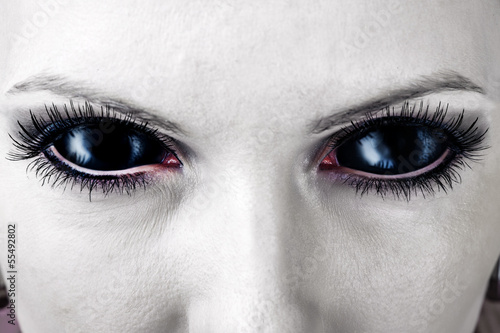 Obraz na płótnie Evil black female zombie eyes.