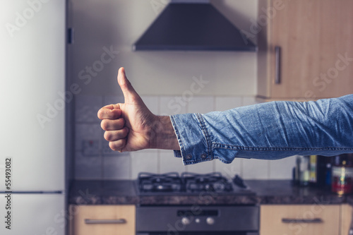 фотографія Thumbs up in clean and tidy kitchen