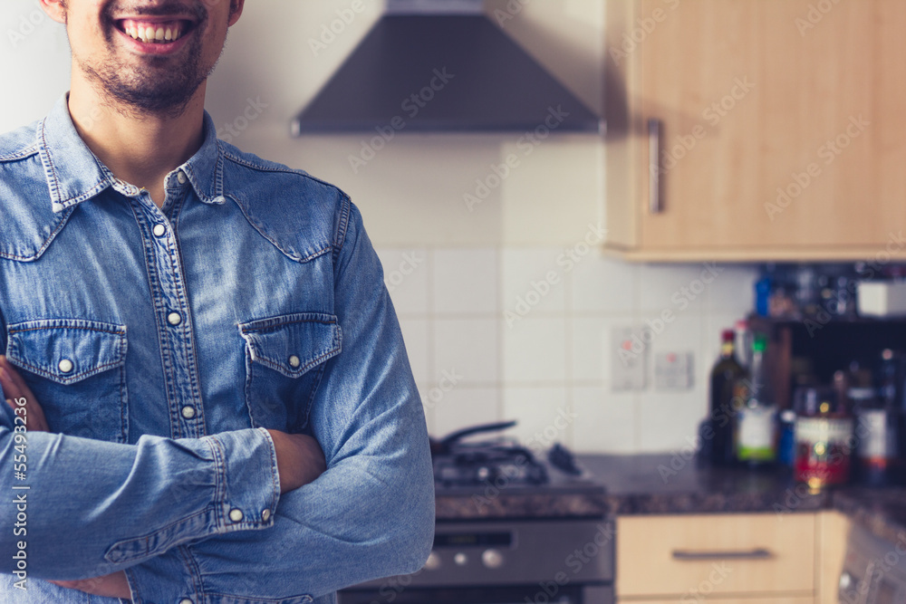 Happy young man in tidy kitchen Happy young man in tidy kitchen