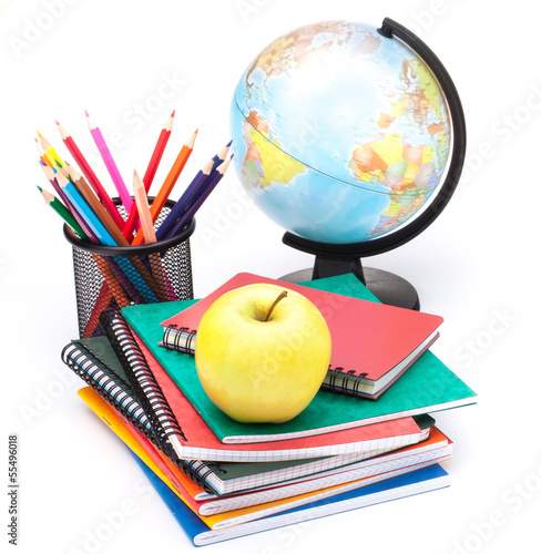 Globe, notebook stack and pencils. Schoolchild and student studi