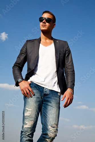 Portrait of  a beautiful young man outdoors