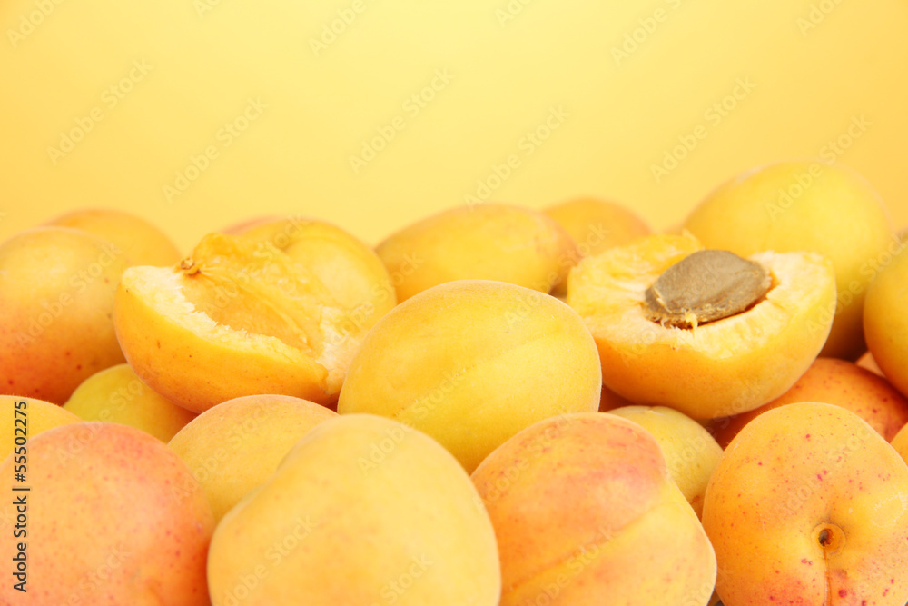 Fresh natural apricot on orange background