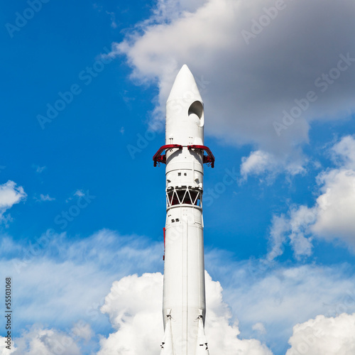 rocket Vostok and blue sky with clouds