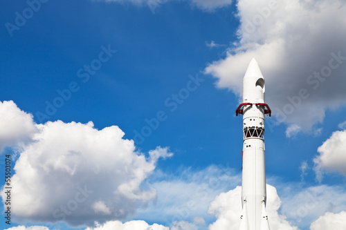 space rocket Vostok and blue sky with clouds