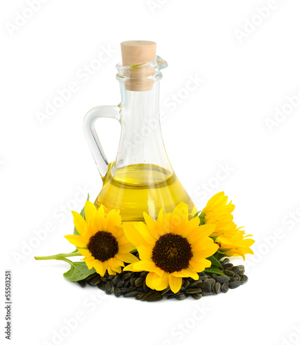 Decorative sunflowers with oil in glass jug