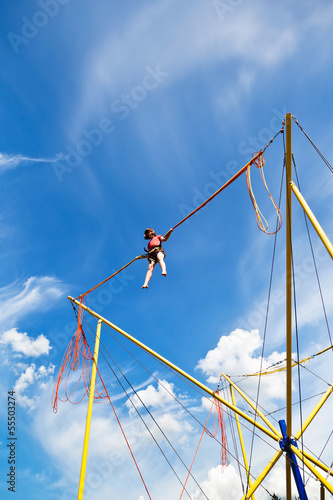 Obraz na plátně girl on bungee cord device