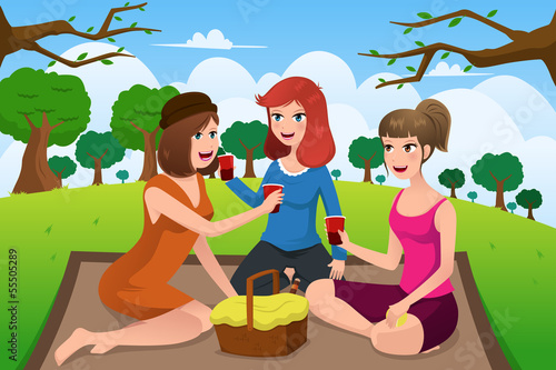 Young women having picnic in a park