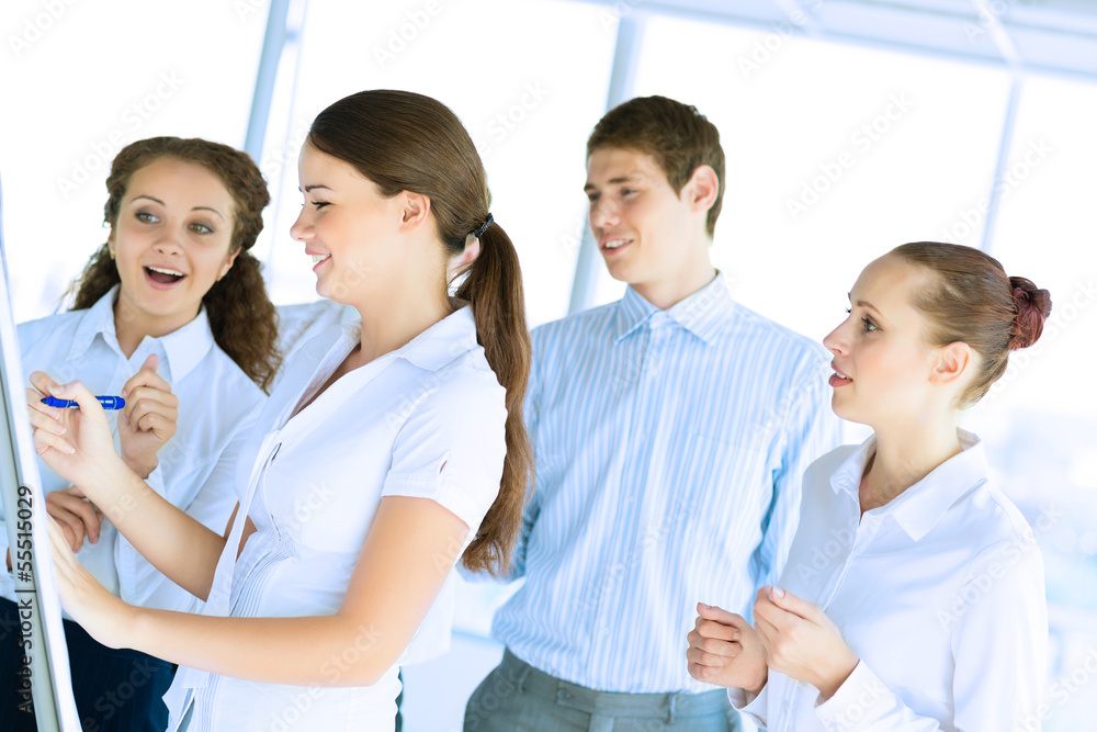 businessmen are meeting near the flipchart